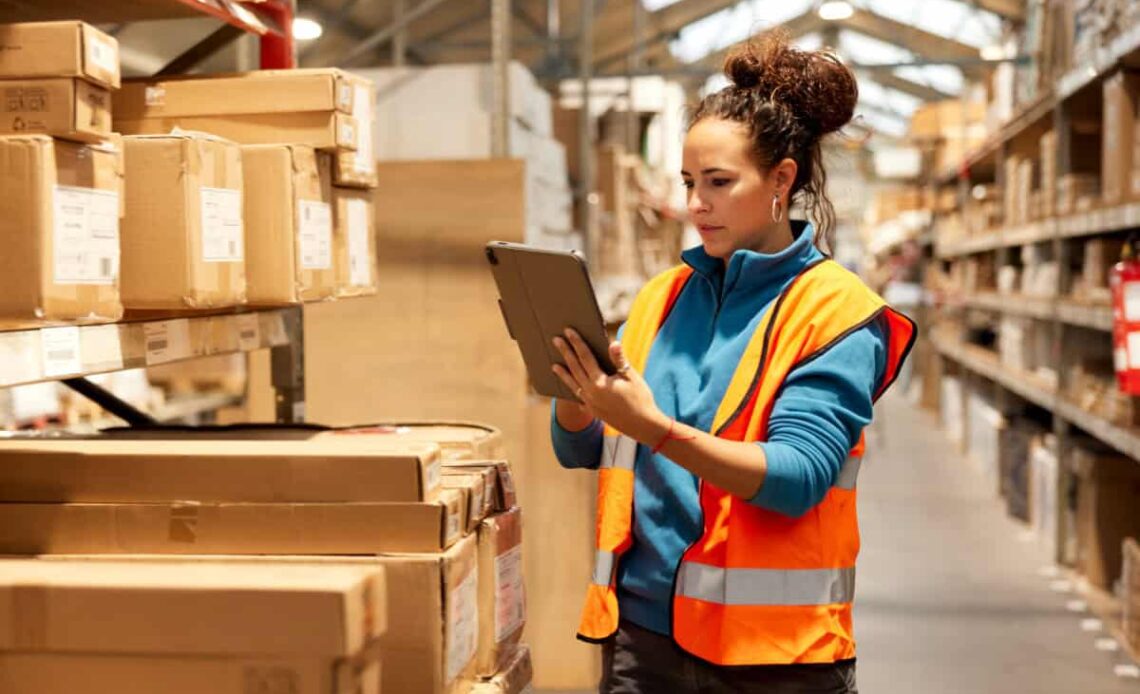 warehouse worker takes inventory in storage room