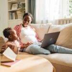 pregnant mother juggles work and childcare